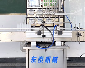 6頭液體灌裝機+四輪搓蓋機